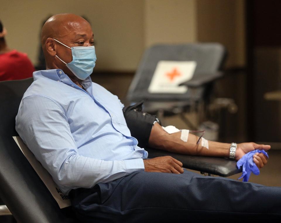 Franklin Myles of Hudson makes a donation during a blood drive at the American Red Cross, Tuesday, Sept. 14, 2021, in Akron, Ohio. The Red Cross is seeking more Black donors because many Black people have distinct markers on their red blood cells that make their blood donations ideal for patients with sickle cell disease