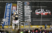 CHARLOTTE, NC - MAY 19: Jimmie Johnson, driver of the #48 Lowe's Patriotic Chevrolet, crosses the finish line to win the NASCAR Sprint All-Star Race at Charlotte Motor Speedway on May 19, 2012 in Charlotte, North Carolina. (Photo by Streeter Lecka/Getty Images)