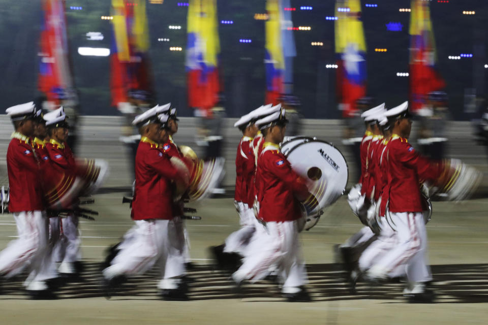 A military band parades march during a parade to commemorate Myanmar's 79th Armed Forces Day, in Naypyitaw, Myanmar, Wednesday, March 27, 2024. (AP Photo/Aung Shine Oo)