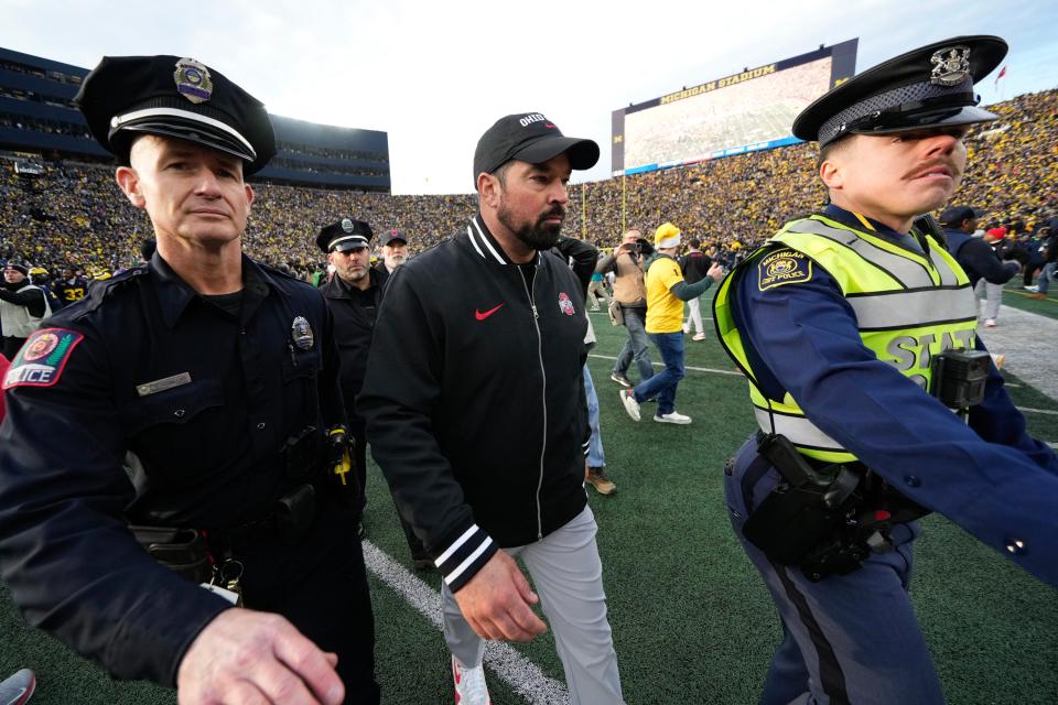 Nov 25, 2023; Ann Arbor, Michigan, USA; Ohio State Buckeyes head coach Ryan Day leaves the field following the NCAA football game against the Michigan Wolverines at Michigan Stadium. Ohio State lost 30-24.