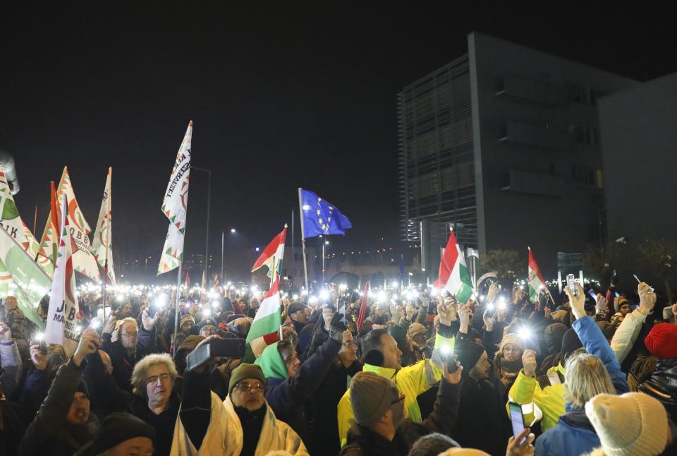 Protesters during the rally held against the government in front of the headquarters of the public broadcaster MTVA in Budapest, Hungary, Monday, December 17, 2018. (Balazs Mohai/MTI via AP)