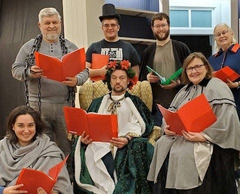 Some of the cast from Monroe Community Players’ Readers Theater offering “A Christmas Carol” pose for a photo. Pictured are (top row, from left): John Zawacki, Nicholas Todd, Ryan Harris, Valinda Jonas, (bottom row) Jessica Dougherty, John "JB" Burden (as Christmas Present) and Betsy Rothrock.