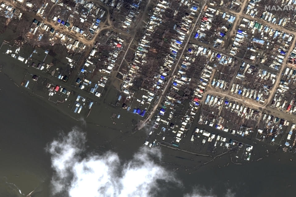 This image provided by Maxar Technologies, shows flooded areas in Akbulak, Russia, Wednesday, April 3, 2024. State media say Russia's government has declared the situation in flood-hit areas in the Orenburg region a federal emergency. (Satellite image ©2024 Maxar Technologies via AP)