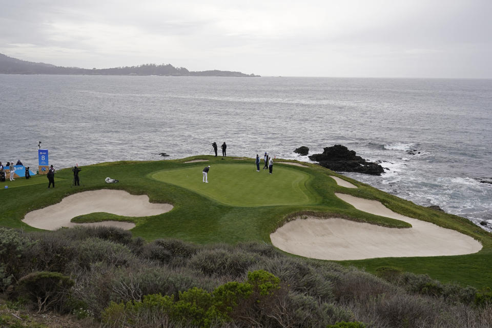 Daniel Berger putts on the seventh green of the Pebble Beach Golf Links during the final round of the AT&T Pebble Beach Pro-Am golf tournament Sunday, Feb. 14, 2021, in Pebble Beach, Calif. (AP Photo/Eric Risberg)