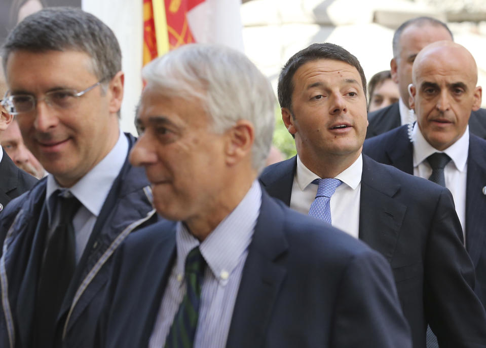 Italian Prime Minister Matteo Renzi arrives at the Expo 2015 headquarters during his visit in Milan, Italy, Tuesday, May 13, 2014. Renzi later visited the Expo 2015 construction site, where more than 132 countries will be establishing their pavilions for the world's fair that will open on May 1, 2015 and continue until the end of October of that year. (AP Photo/Antonio Calanni)