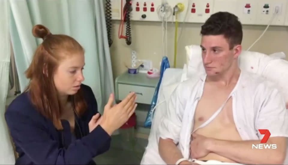 Davis, in hospital with his girlfriend after the attack. Source: 7 News