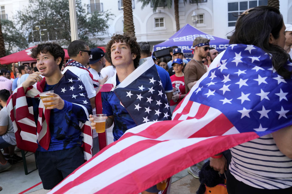 Sebastian Borrero, left, and Lucas Alonso, right, watch during World Cup soccer watch party at the Fritz & Franz Bierhaus, Saturday, Dec. 3, 2022, in Coral Gables, Fla., as the United States take on the Netherlands in the Qatar 2022 World Cup Round of 16 soccer match. (AP Photo/Lynne Sladky)