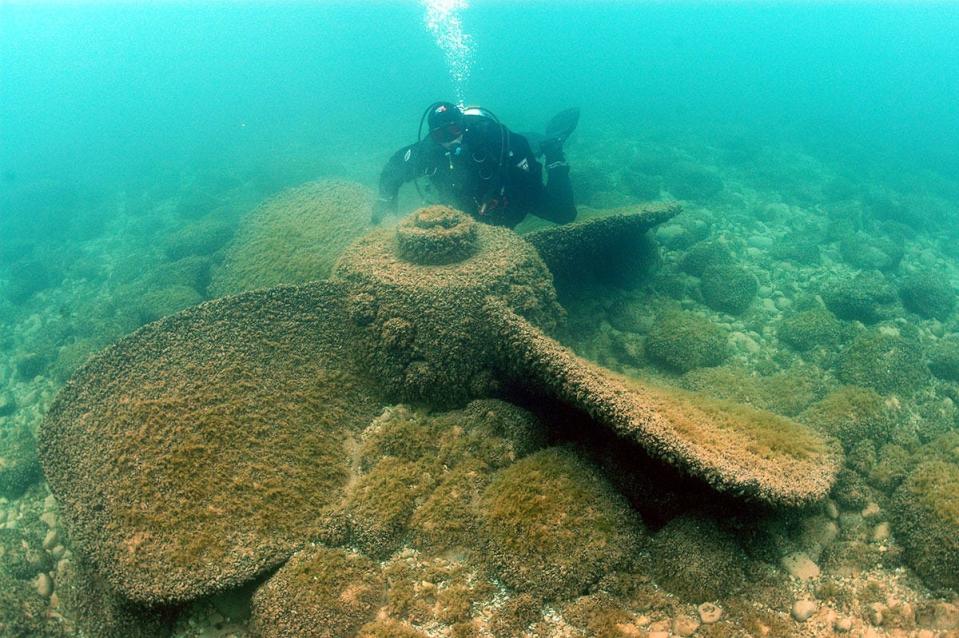 An archaeologist investigates a propeller near the Appomattox wreck site, 150 yards off Atwater Beach in Milwaukee County.