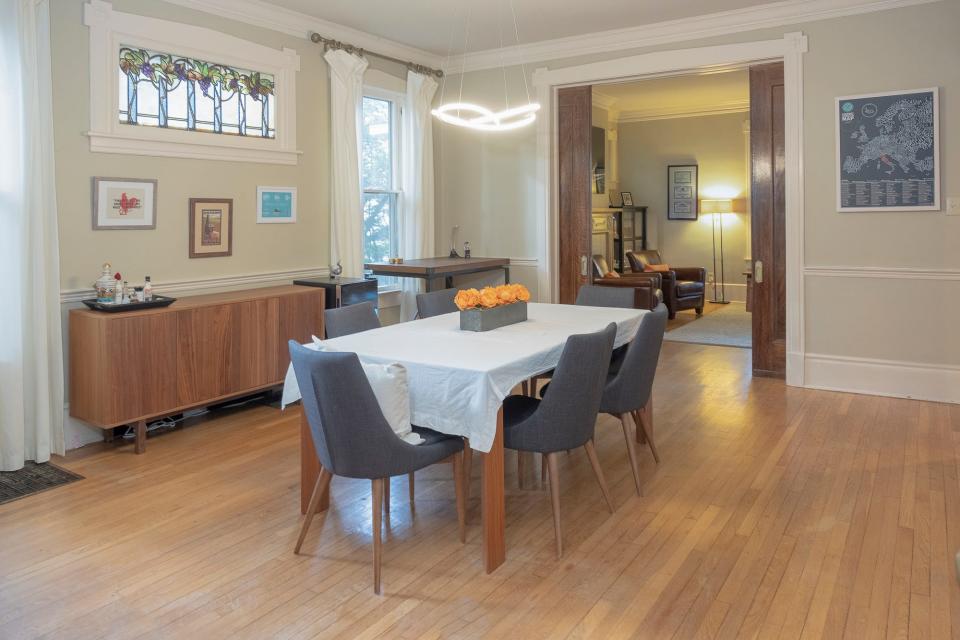 The formal dining room is spacious and allows for a large gathering of friends and family.