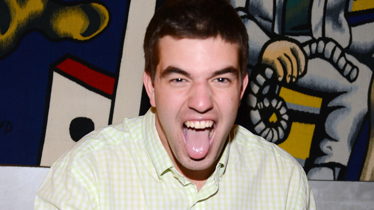  A photo of Fyre Fest's Billy McFarland sticking his tongue out in 2014 