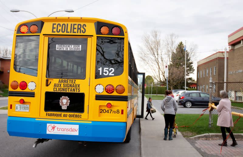 FILE PHOTO: A school bus arrives carrying one student as schools reopen outside the greater Montreal region in Saint-Jean-sur-Richelieu