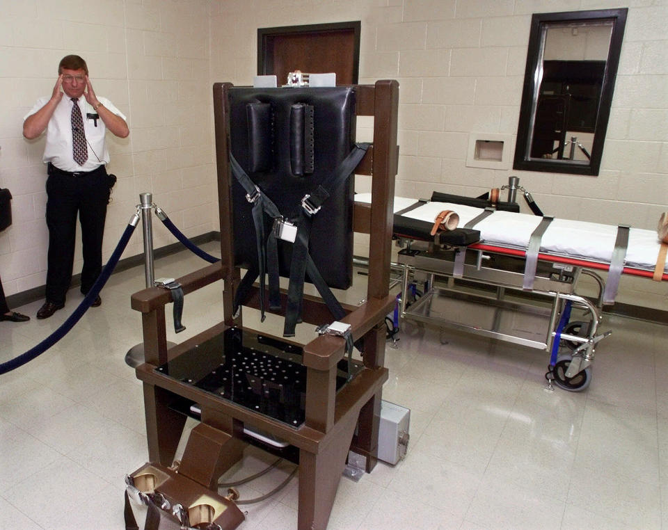 FILE - In this Oct. 13, 1999, file photo, Ricky Bell, the warden at Riverbend Maximum Security Institution in Nashville, Tenn., gives a tour of the prison's execution chamber. If Tennessee electrocutes Zagorski, it will be in an electric chair built by a self-taught execution expert who is no longer welcome in the prison system. (AP Photo/Mark Humphrey, File)