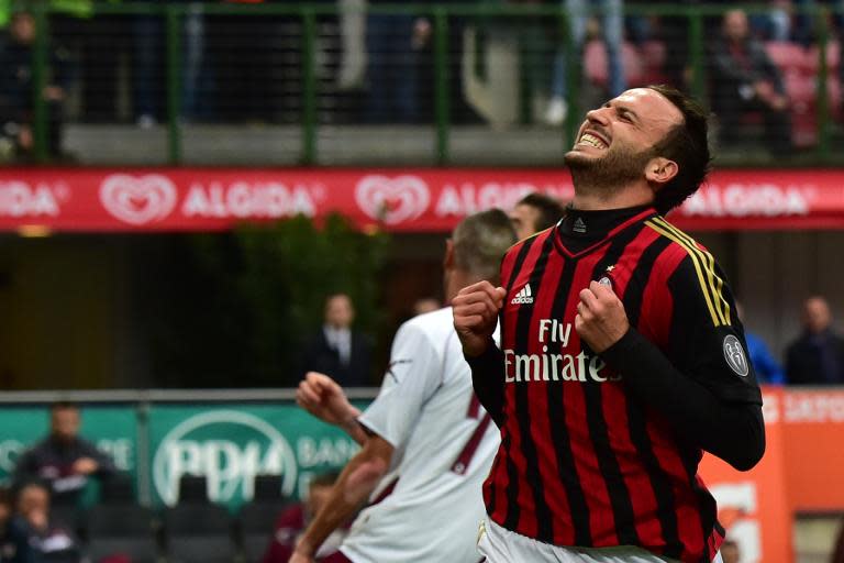 AC Milan's forward Giampaolo Pazzini celebrates after scoring during an Italian Serie A football match against Livorno at San Siro Stadium in Milan on April 19, 2014