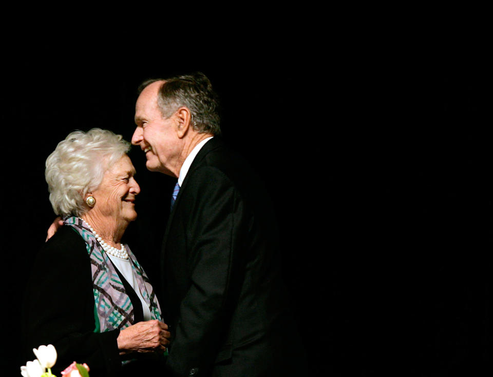 Former President George H.W. Bush, embraces former First Lady Barbara Bush after she introduced the former President at the Genesis Women's Shelter Mother's Day Luncheon in Dallas, Texas, on May 3, 2006.