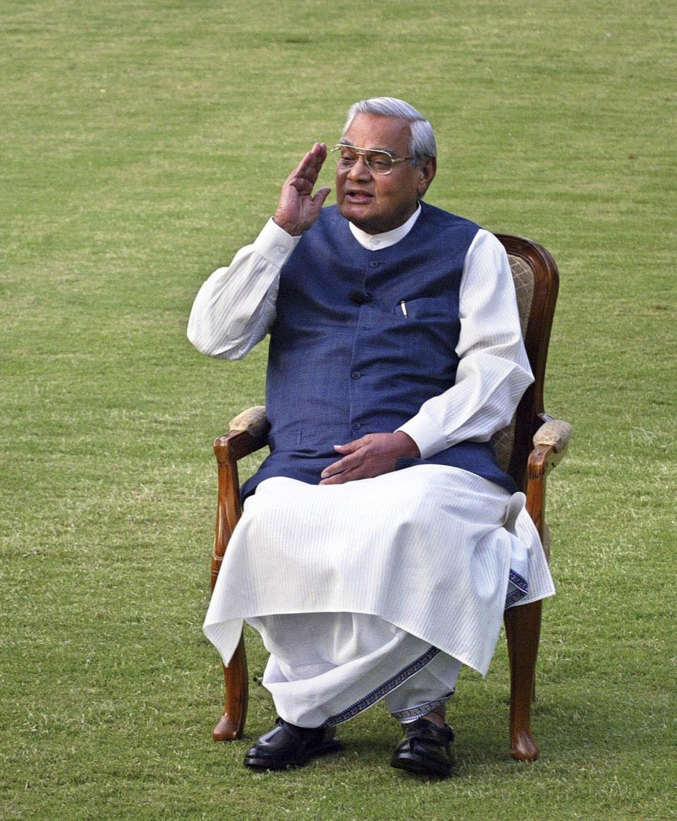 FILE - In this March 25, 2004 file photo, Indian Prime Minister Atal Bihari Vajpayee gestures during a photo session at his residence in New Delhi, India. Former prime minister Vajpayee, who pursued both nuclear weapons and peace talks with Pakistan, died Thursday, Aug. 16, 2018, at age 93. (AP Photo/Manish Swarup, File)