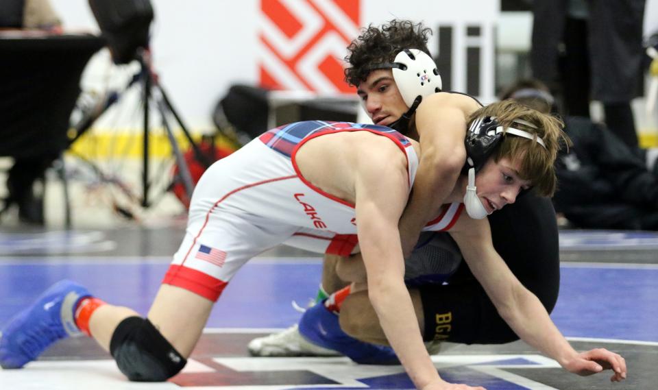 Charlie Desena of Lake Highland Prep, left, was a 7-5 overtime winner over Bainbridge-Guilford/Afton/Harpursville's Darren Florance in the 110-pound championship match as Elmira's First Arena hosted the Southern Tier Classic wrestling tournament Jan. 14, 2022.