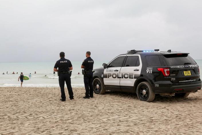 Miami Beach police officers at South Pointe Beach on Sunday, August 2, 2020.