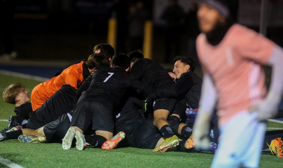 Washburn Rural dog piles after Draden Chooncharoen's game winning goal against Garden City in the Class 6A State Quarterfinal on Tuesday, Oct. 31.