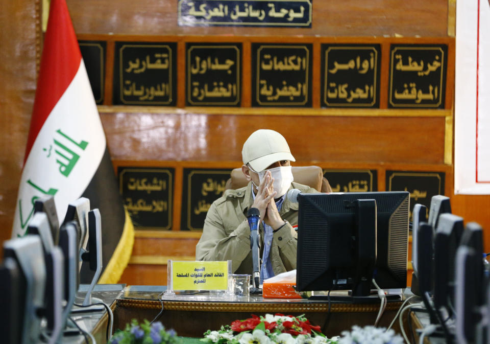 Iraqi Prime Minister Mustafa al-Kadhimi speaks to the journalists at Iraq-Iran border crossing of Mandali in northern province of Diyala, Iraq, Saturday, July, 11, 2020. Al-Kadhimi launched a campaign in the northern province of Diyala to enforce the proper payment of taxes on imported goods and recover "hundreds of millions of dollars" in revenues lost to bribery and other illicit practices. Security forces from the Interior Ministry would supervise the work of border guards in the first step of the campaign in the Mandili border crossing, he told reporters. (Thaier al-Sudani/Pool Photo via AP)