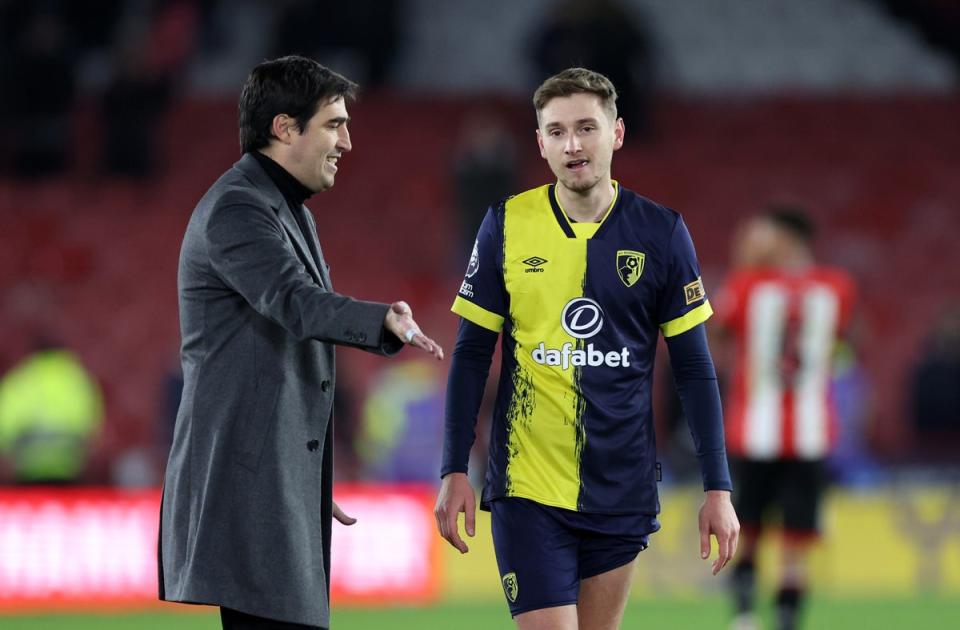The manager speaks to midfielder David Brooks (Getty)