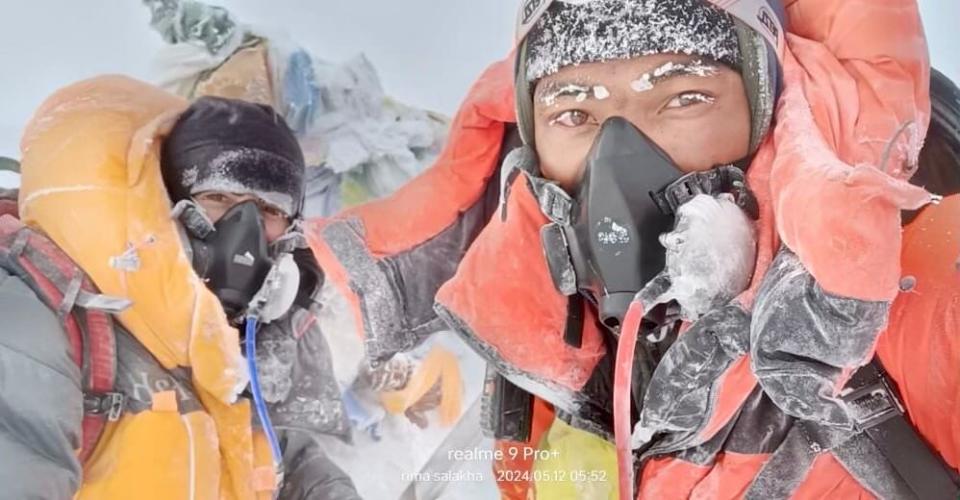 Landry Warnez (left) on the top of Mount Everest after a four day ascent.