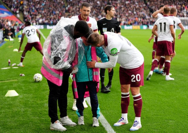 West Ham captain Jarrod Bowen consoling a ball boy