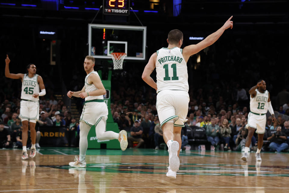 Boston Celtics guard Payton Pritchard (11) celebrates after his 3-point basket during the second half of a preseason NBA basketball game against the Philadelphia 76ers, Sunday, Oct. 8, 2023, in Boston. (AP Photo/Mary Schwalm)