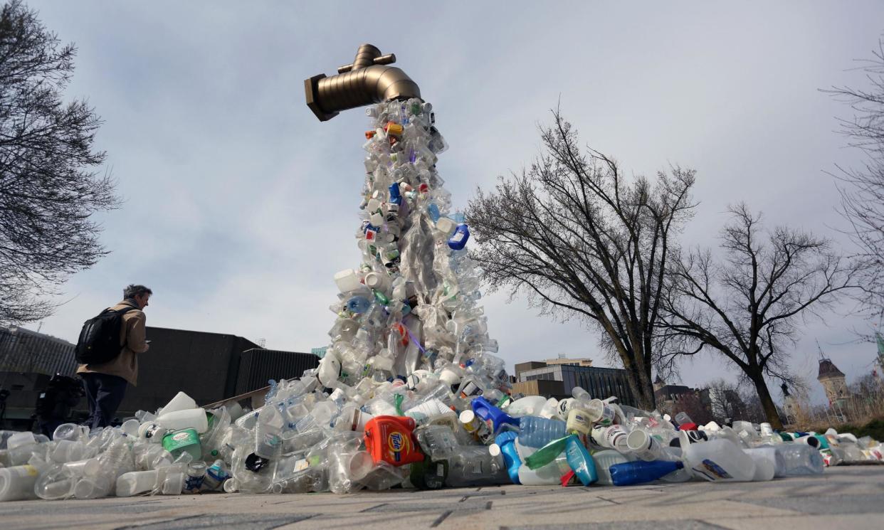 <span>The sculpture Giant Plastic Tap, by the Canadian artist Benjamin Von Wong, on display outside the Ottawa talks building.</span><span>Photograph: Dave Chan/AFP/Getty Images</span>