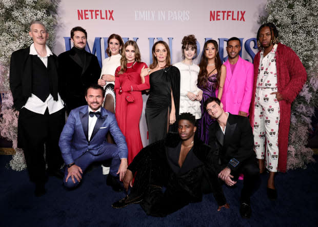 NEW YORK, NEW YORK - DECEMBER 15: (L-R) Bruno Gouery, Lucas Bravo, William Abadie, Kate Walsh, Camille Razat, Philippine Leroy-Beaulieu, Samuel Arnold, Lily Collins, Ashley Park, Paul Forman, Lucien Laviscount, and Jeremy O. Harris attend the Emily In Paris French Consulate Red Carpet at French Consulate on December 15, 2022 in New York City. (Photo by Jamie McCarthy/Getty Images for Netflix)<p><a href="https://www.gettyimages.com/detail/1449510094" rel="nofollow noopener" target="_blank" data-ylk="slk:Jamie McCarthy/Getty Images;elm:context_link;itc:0;sec:content-canvas" class="link ">Jamie McCarthy/Getty Images</a></p>
