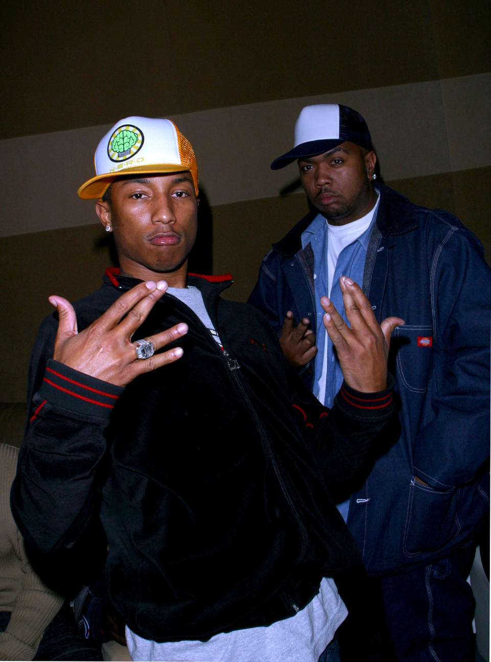 Pharrell Williams and Timbaland in baseball caps