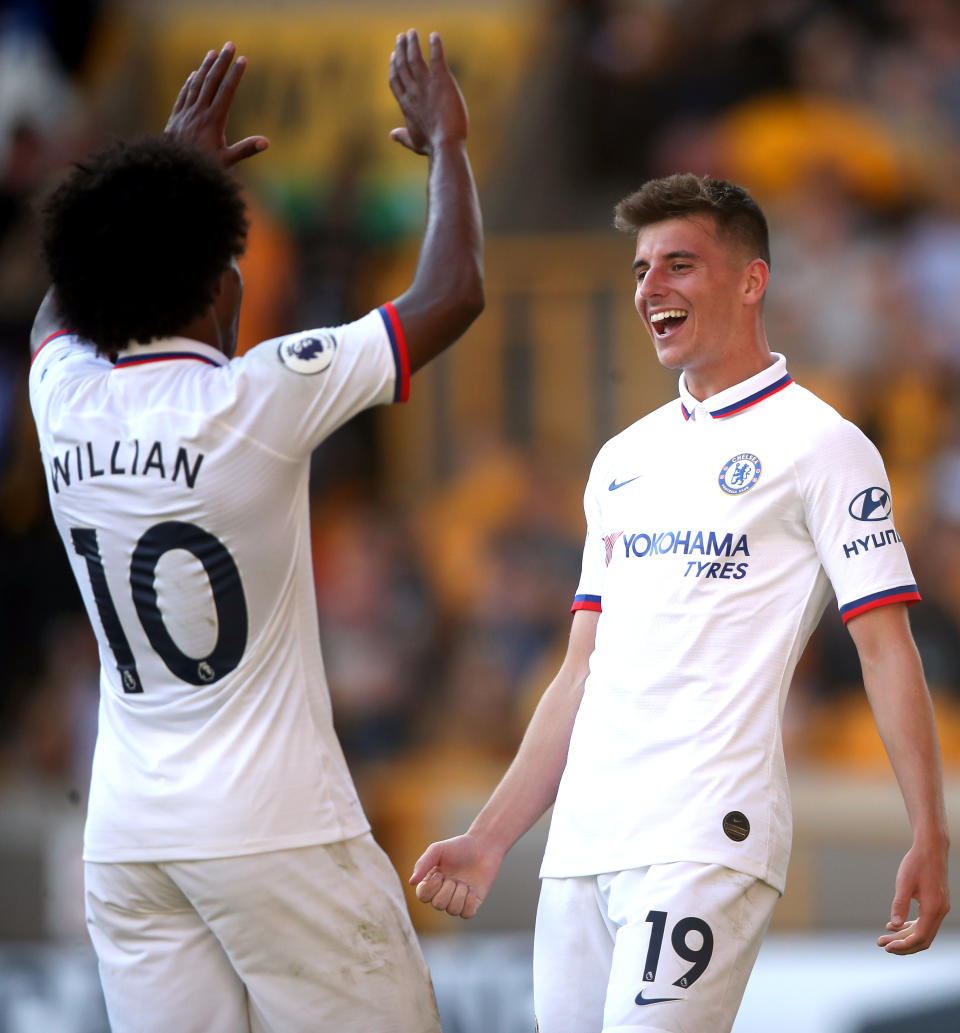 Chelsea's Mason Mount (right) celebrates scoring his side's fifth goal of the game with team-mate Willian during the Premier League match at Molineux, Wolverhampton. (Photo by Nick Potts/PA Images via Getty Images)