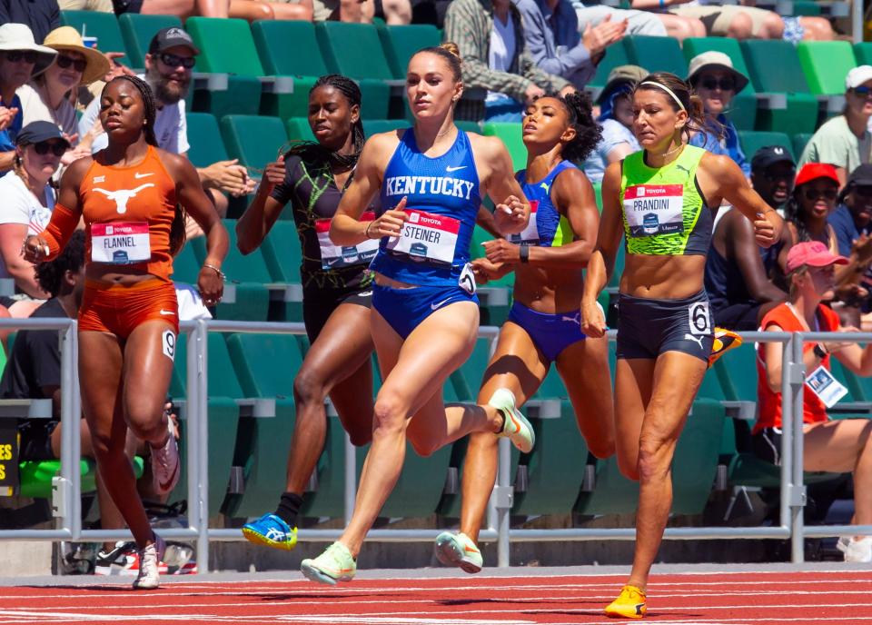 Abby Steiner, center, wins the women's 200 meters with third place finisher Jenna Prandini, right, on the final day of the USA Track and Field Champi's 2onships 2022 at Hayward Field in Eugene Sunday June 26, 2022.