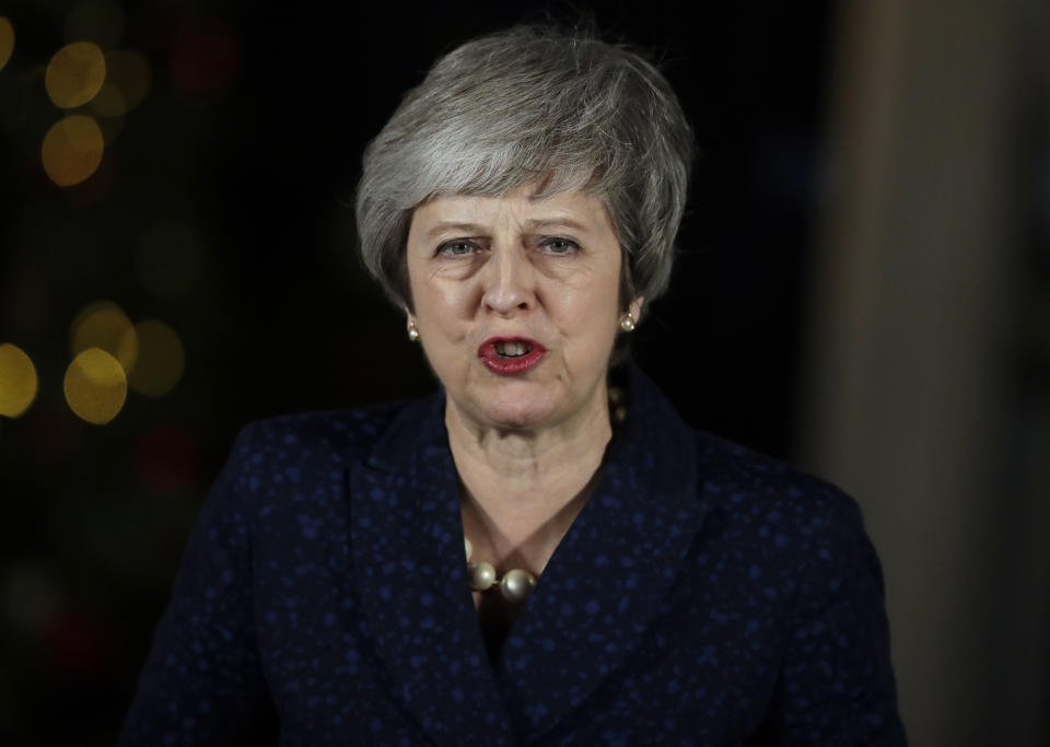 Britain's Prime Minister Theresa May delivers a speech outside 10 Downing Street in London, Wednesday, Dec. 12, 2018. British Prime Minister Theresa May survived a brush with political mortality Wednesday, winning a no-confidence vote of her Conservative lawmakers that would have ended her leadership of party and country. (AP Photo/Matt Dunham)