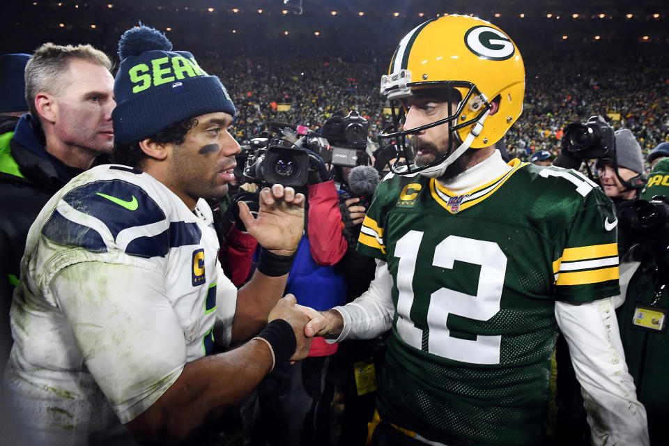 GREEN BAY, WISCONSIN - JANUARY 12: Russell Wilson #3 of the Seattle Seahawks greets Aaron Rodgers #12 of the Green Bay Packers after the Packers defeated the Seahawks 28-23 in the NFC Divisional Playoff game at Lambeau Field on January 12, 2020 in Green Bay, Wisconsin. (Photo by Stacy Revere/Getty Images)