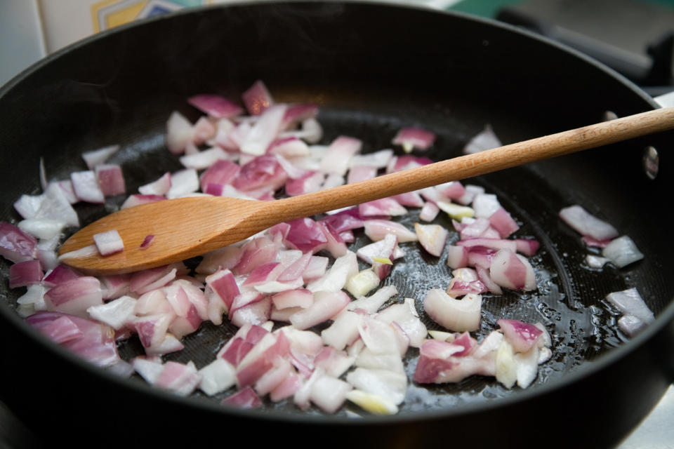 Onions frying in a pan.