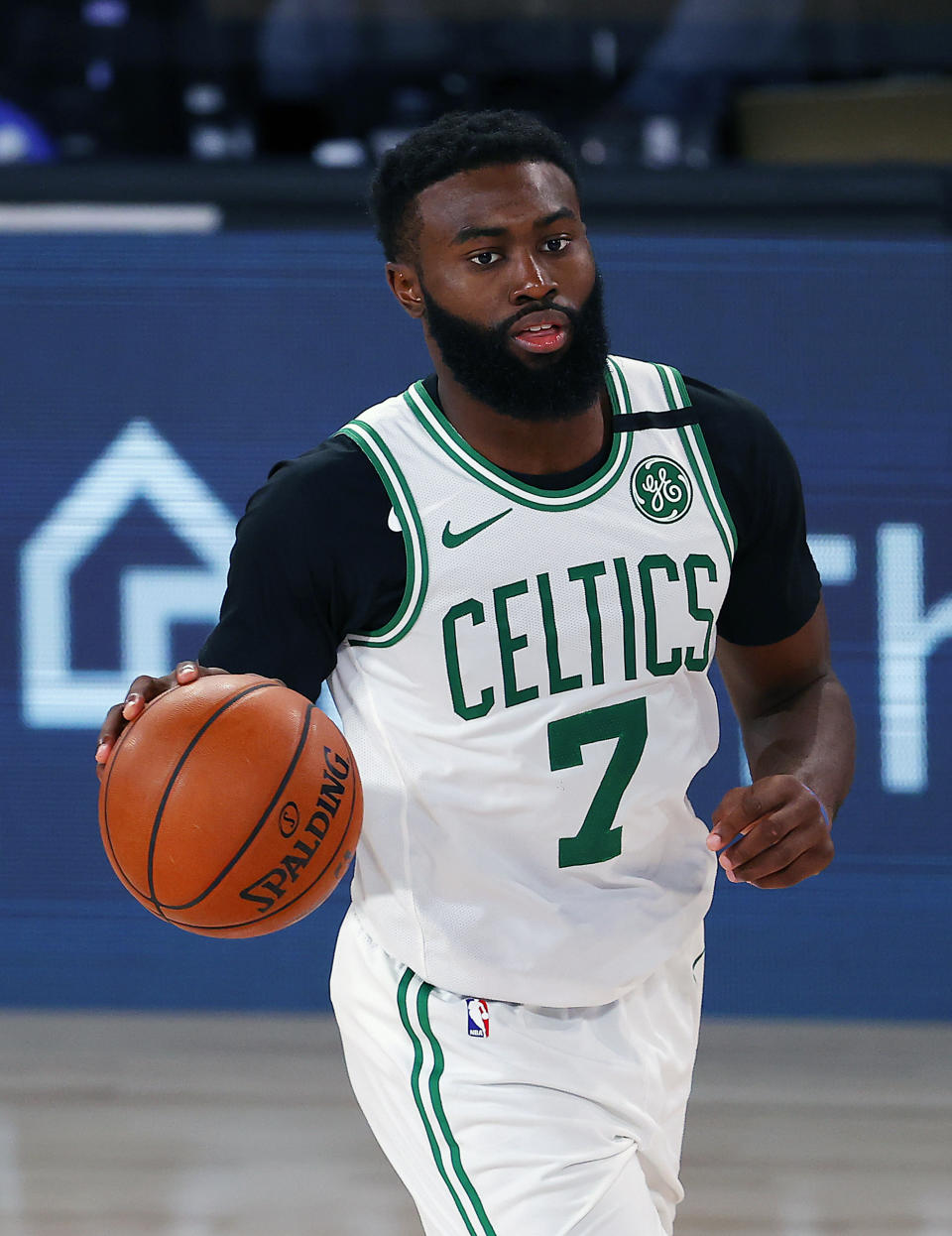 Boston Celtics' Jaylen Brown handles the ball during the second half of an NBA basketball game against the Memphis Grizzlies Tuesday, Aug. 11, 2020, in Lake Buena Vista, Fla. (AP Photo/Mike Ehrmann, Pool)