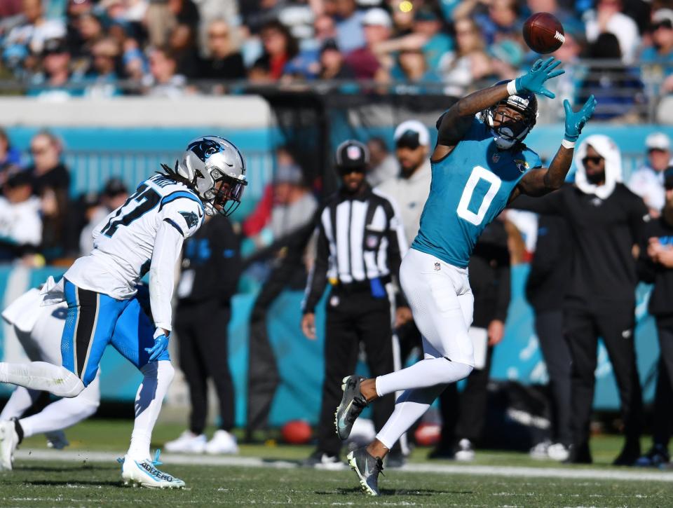 Jacksonville Jaguars wide receiver Calvin Ridley (0) stretches for the ball on a short yardage pass play during third quarter action. The Jacksonville Jaguars hosted the Carolina Panthers at EverBank Stadium in Jacksonville, FL Sunday, December 31, 2023. The Jaguars went in at the half with a 9 to 0 lead and came away with a 26 to 0 victory over the Panthers. [Bob Self/Florida Times-Union]