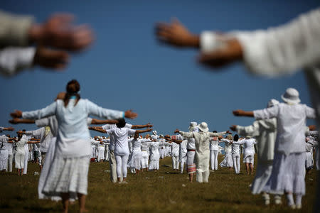 Followers of the Universal White Brotherhood, an esoteric society that combines Christianity and Indian mysticism set up by Bulgarian Peter Deunov in the 1920s, perform a dance-like ritual called "paneurhythmy" in Rila Mountain, Bulgaria, August 19, 2017. REUTERS/Stoyan Nenov