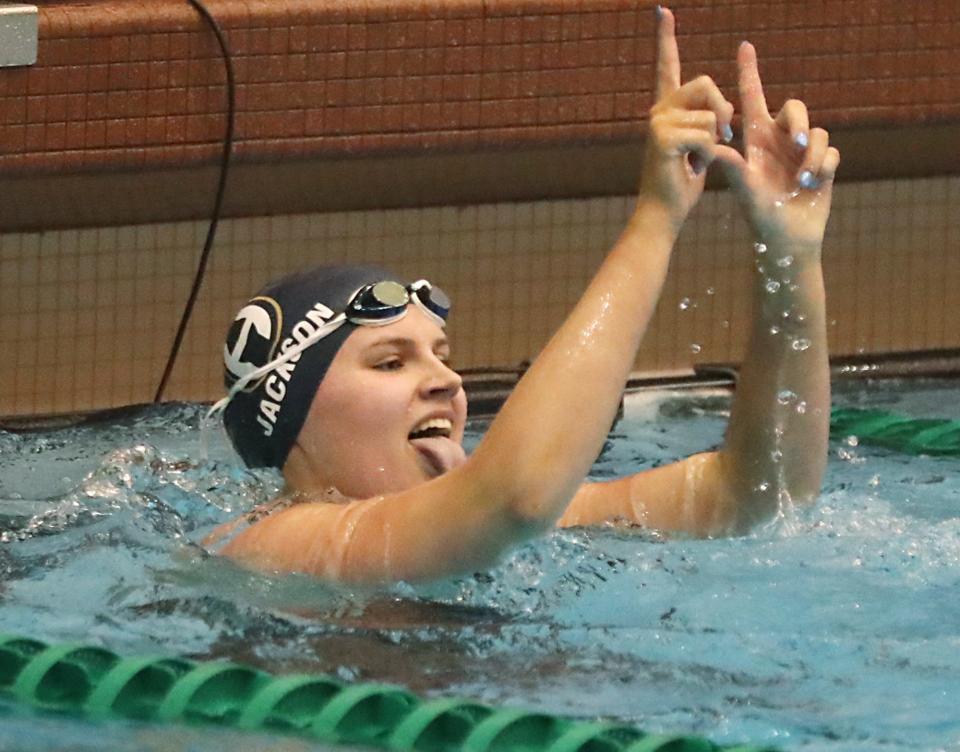 Archbishop Hoban's Rylee Jackson celebrates her first-place finish in the Northeast District 50 freestyle at Robert F. Busbey Natatorium at Cleveland State University on Friday, Feb. 16, 2024.