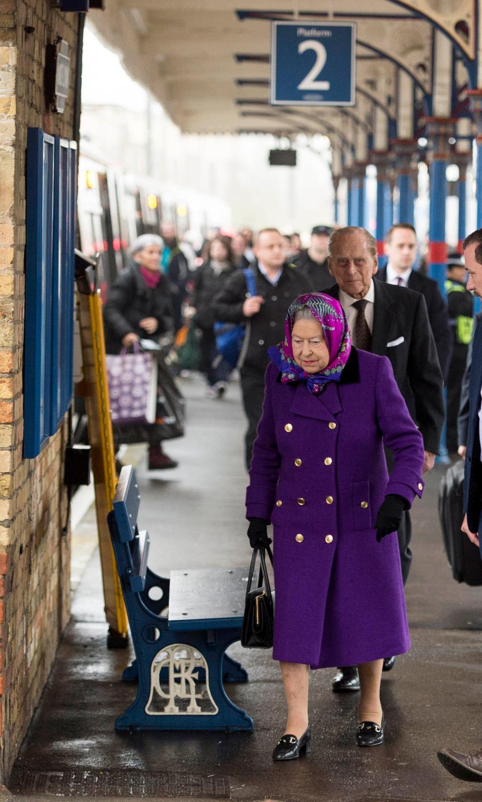 Queen Elizabeth and Prince Philip arrive at Kings Lynn train station.