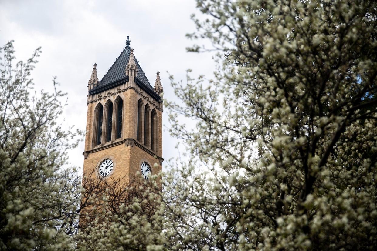 Trees bloom near the Iowa State University campanile, on Sunday, April 26, 2020, in Ames. 