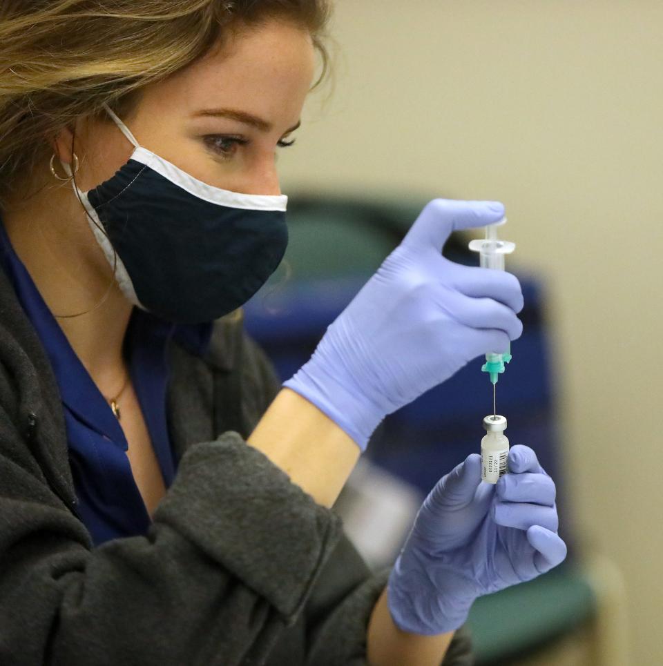 Doses of the Pfizer COVID-19 vaccine are drawn out by a UF Health nurse during a vaccination clinic at Mt. Moriah Missionary Baptist Church in Gainesville on  Jan. 29, 2021.