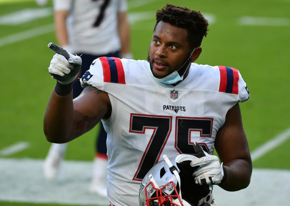 Patriots offensive tackle Justin Herron walks off the field on Dec. 20, 2020, after the Dolphins had defeated New England in Miami Gardens, Fla.