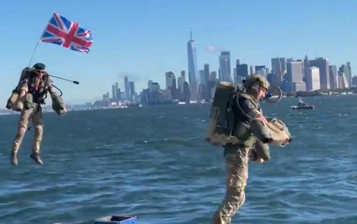 Royal Navy servicemen using jet packs are seen hovering over New York Harbour as they head towards the HMS Queen Elizabeth - You Tube/Gravity Industries