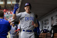 Chicago Cubs' Frank Schwindel waves in the dugout after hitting a two-run home run during the first inning of a baseball game against the Cincinnati Reds in Cincinnati, Tuesday, May 24, 2022. (AP Photo/Aaron Doster)