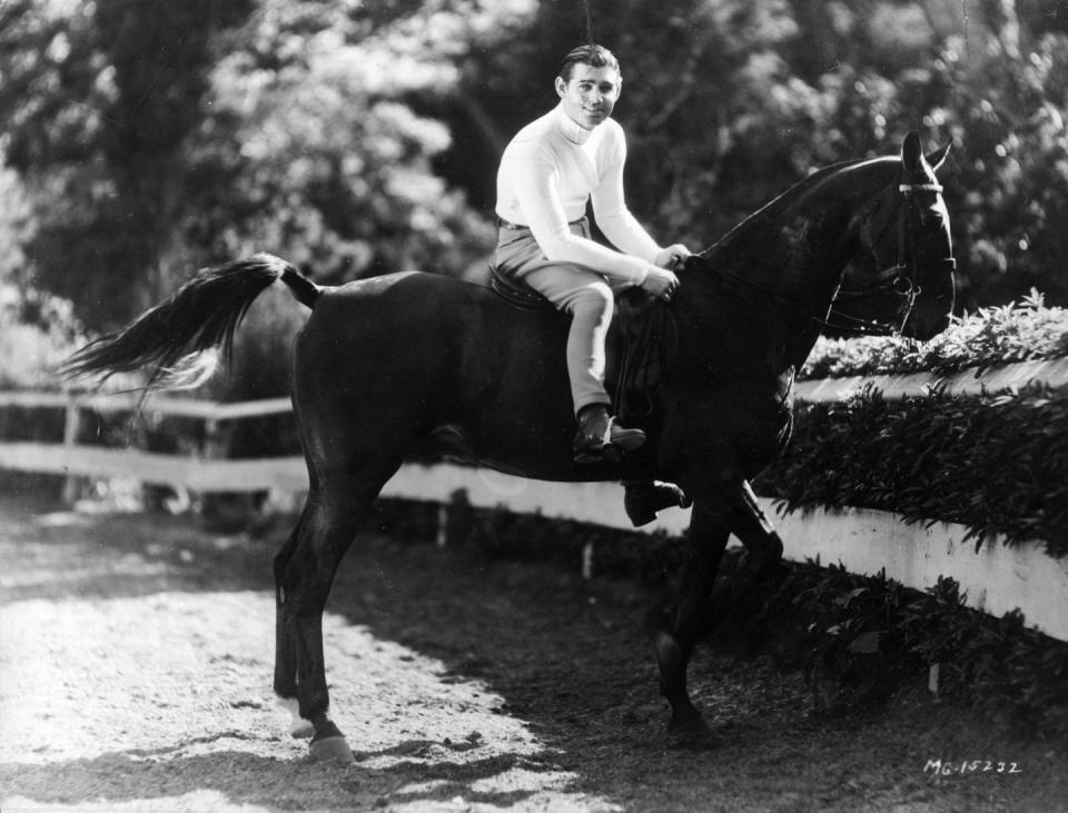<p>Clark Gable and his horse pose for a photograph after a ride in 1940. </p>