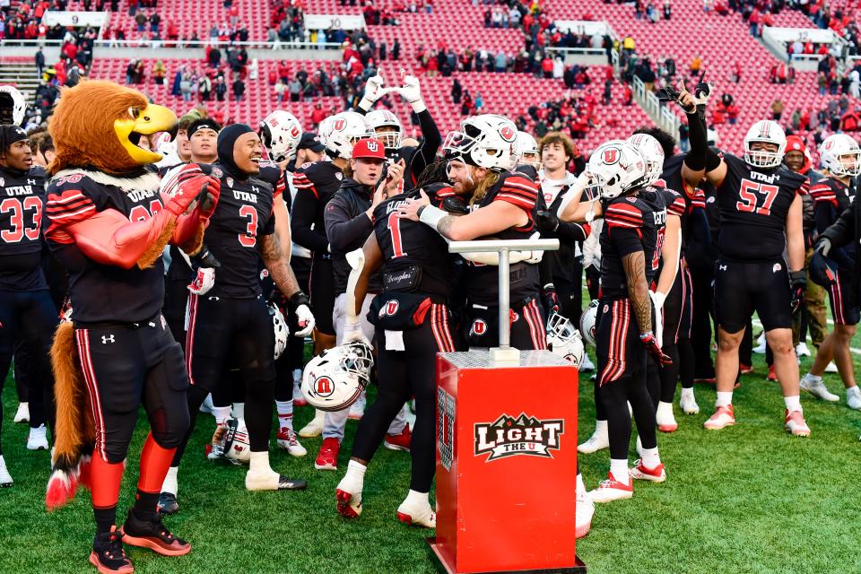 Utah Utes quarterback Luke Bottari (15) lights the â€œUâ€ after defeating the Colorado Buffaloes at Rice-Eccles Stadium.