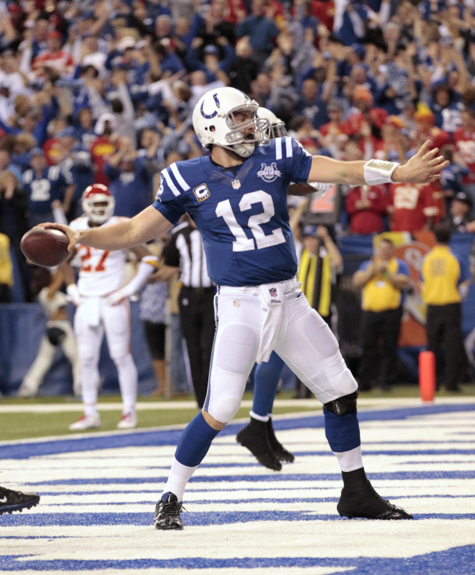 Indianapolis Colts quarterback Andrew Luck (12) celebrates after scoring a touchdown against the Kansas City Chiefs during the second half of an NFL wild-card playoff football game Saturday, Jan. 4, 2014, in Indianapolis. (AP Photo/AJ Mast)