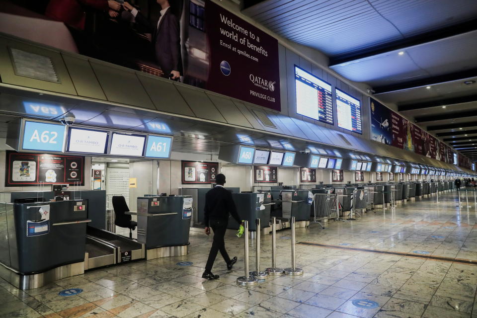 International check-in counters stand empty as several airlines stopped flying out of South Africa, amidst the spread of the new SARS-CoV-2 variant Omicron, at O.R. Tambo International Airport in Johannesburg, South Africa, November 28, 2021. REUTERS/ Sumaya Hisham