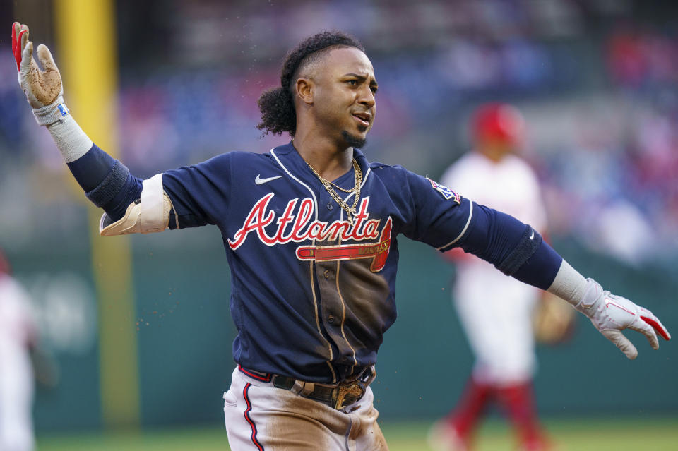Atlanta Braves' Ozzie Albies reacts to his triple during the first inning of the team's baseball game against the Philadelphia Phillies, Wednesday, June 9, 2021, in Philadelphia. (AP Photo/Chris Szagola)